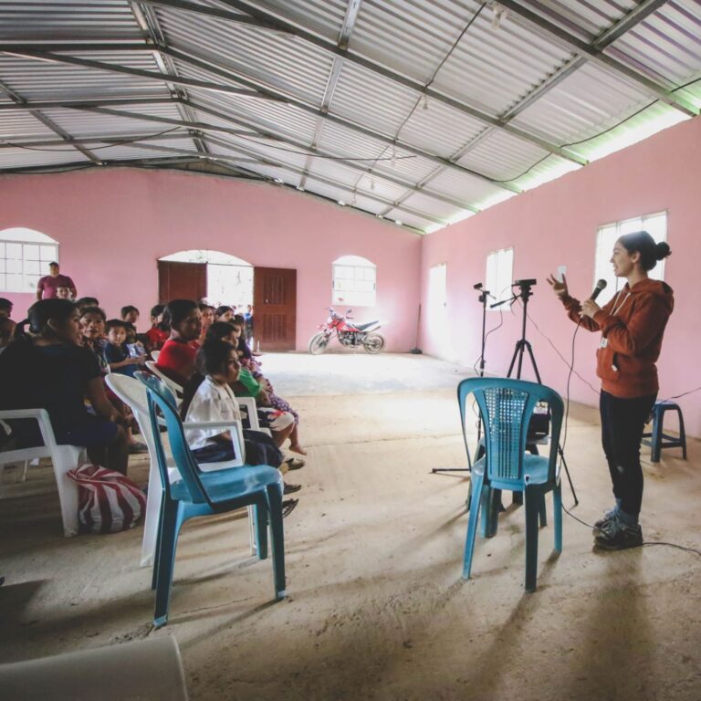 Katie Rinaudo facilitates a short parent training in a rural village in Honduras. (2019)