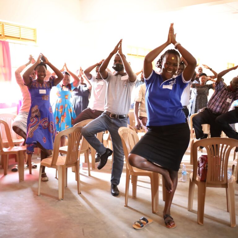Participants practice a self-regulation exercise at a teacher training in Uganda. (2022)